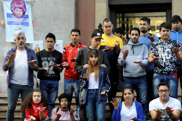 Victims and their families wait outside court as two priests and a gardener receive heavy jail sentences for sexually abusing minors at a school for the deaf in the Argentine city of Mendoza
