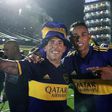Carlos Tevez (L) celebrates winning the Argentine league title with Boca Juniors