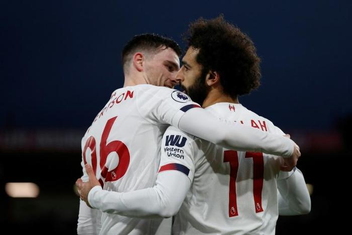 Liverpool's Mohamed Salah (right) celebrates scoring his team's third goal against Bournemouth