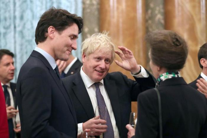 Britain's Princess Anne talks to Britain's Prime Minister Boris Johnson, Canada's Prime Minister Justin Trudeau and other NATO leaders at Buckingham Palace