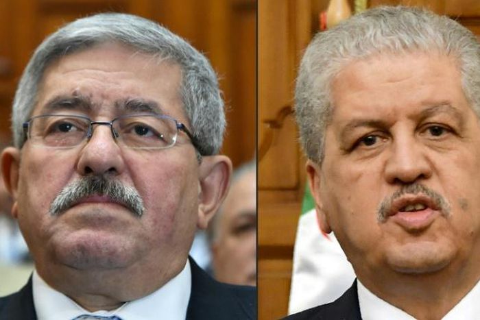 This combination of pictures created on December 10, 2019 shows file photos of then newly appointed Algerian prime minister Ahmed Ouyahia attending a congress session in the capital Algiers on September 4, 2017 and Algerian Prime Minister Abdelmalek Se...