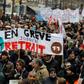 Thousands of people gathered to demonstrate in central Paris against pension reform a month into the protest -- their banner reads "on strike until withdrawal"