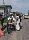 Frugal couple rides a motorbike to their marital home after wedding
