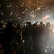 Lebanese security forces react to fireworks hurled  by anti-government protesters in downtown Beirut