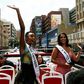 Miss Universe, Zozibini Tunzi (L) waved to crowds who came out to greet her and celebrate her victory