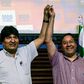 Bolivia's ex-President Evo Morales (L) and presidential candidate for his Movement for Socialism (MAS) party, Luis Arce, pose at a news conference in Buenos Aires