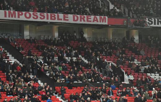 No hope: Manchester United fans left early during Wednesday's 2-0 defeat to Burnley