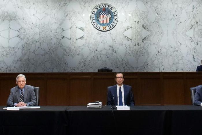 Senate Majority Leader Mitch McConnell (L), Treasury Secretary Steven Mnuchin and top Senate Democrat Chuck Schumer (R) have launched negotiations on the $1 trillion stimulus plan