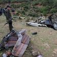 Tunisian security forces check the remains of a bus that plunged over a cliff into a ravine, in Ain Snoussi in northern Tunisia on December 1, 2019 killing 24 people