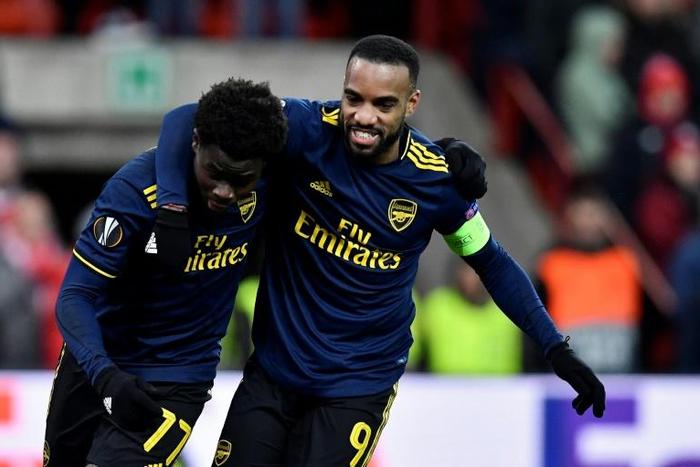 Double act: Bukayo Saka celebrates with Alexandre Lacazette
