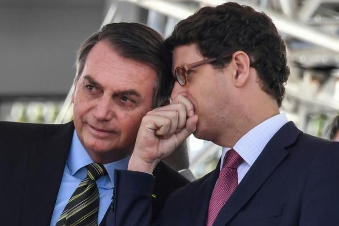 Brazilian President Jair Bolsonaro (L), with his Environment Minister Ricardo Salles in October 2019, has been widely criticized for easing restrictions on exploiting the Amazon's vast riches, leading to an acceleration in deforestation