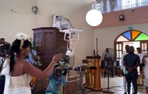 The moment drone delivers the rings for Despite’s son white wedding