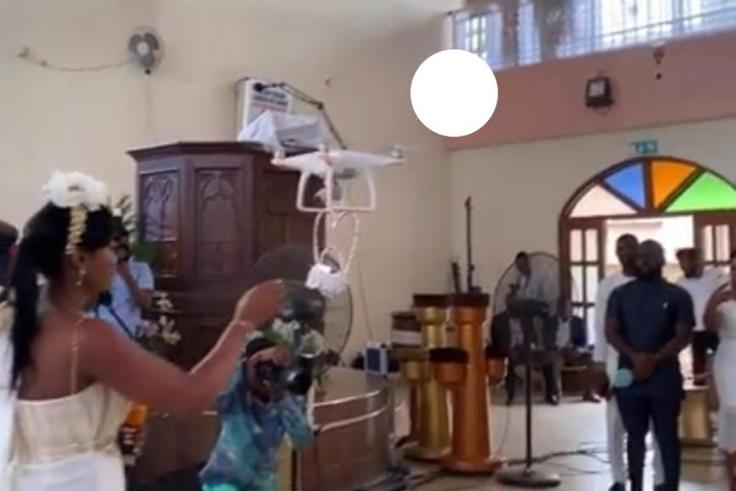 The moment drone delivers the rings for Despite’s son white wedding