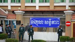Police officers surrounded Phnom Penh Court on Wednesday as Cambodian opposition leader Kem Sokha arrived for his treason trial