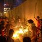 Iraqi demonstrators set tires ablaze behind the walls protecting the Iranian consulate in the Shiite holy city of Karbala, south of Iraq's capital Baghdad, on November 3