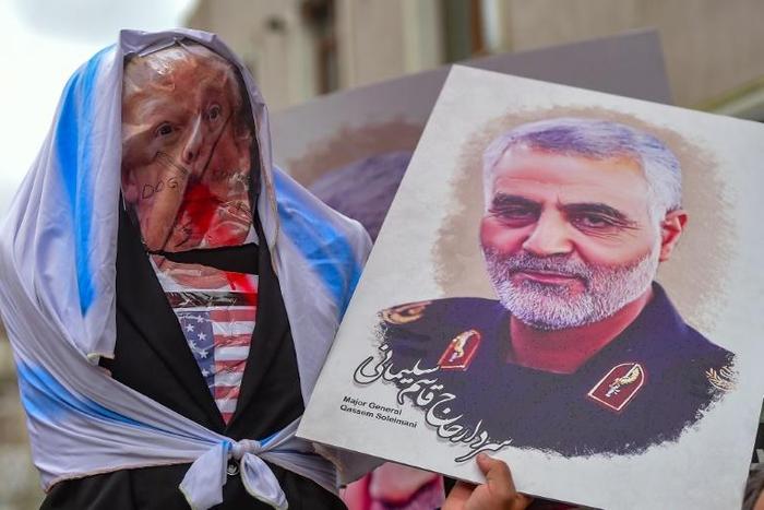 Congressional Democrats seek to restrain President Donald Trump, after he ordered the killing of top Iranian commander Qasem Soleimani, pictured here alongside an effigy of the US leader