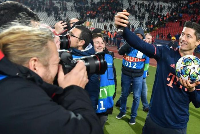 Bayern Munich's Polish forward Robert Lewandowski marks his four goals in 15 minutes on Tuesday by taking a selfie with the matchball in Belgrade.
