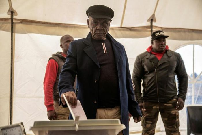 Lesotho Prime Minister Thomas Thabane (C) was summoned by police for questioning over alleged links to the 2017 murder of his estranged wife