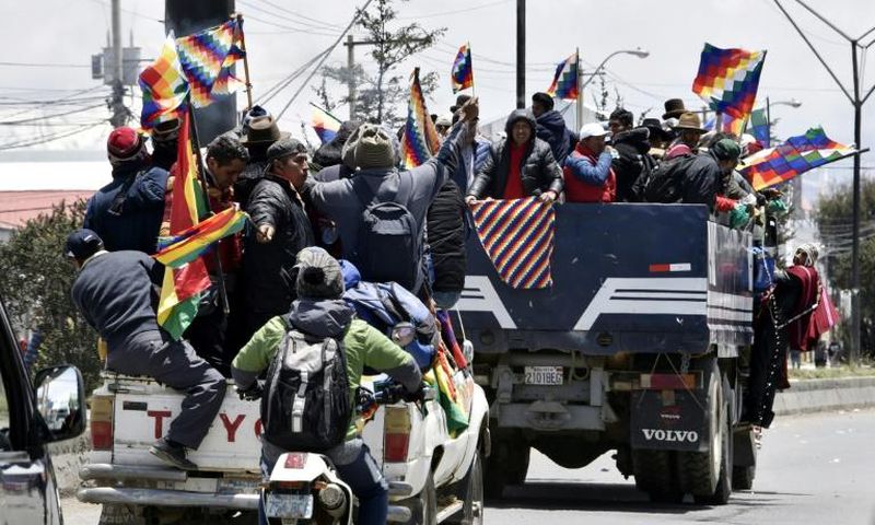 Indigenous supporters of Bolivian ex-president Evo Morales travel from El Alto to La Paz to protest against the interim government on November 15, 2019