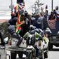 Indigenous supporters of Bolivian ex-president Evo Morales travel from El Alto to La Paz to protest against the interim government on November 15, 2019