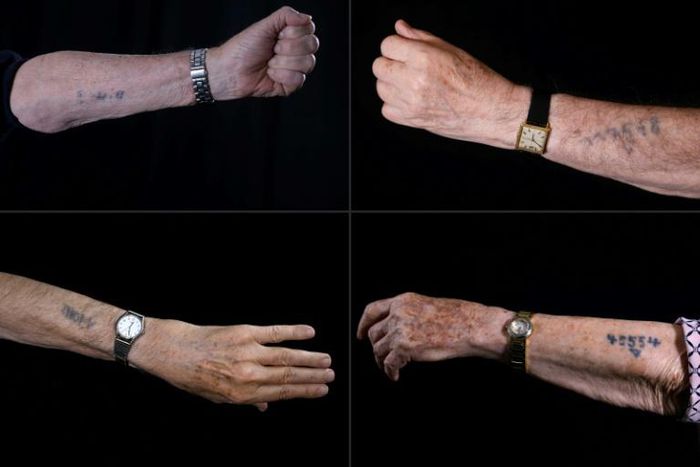 Holocaust survivors show Auschwitz prison numbers on their arms