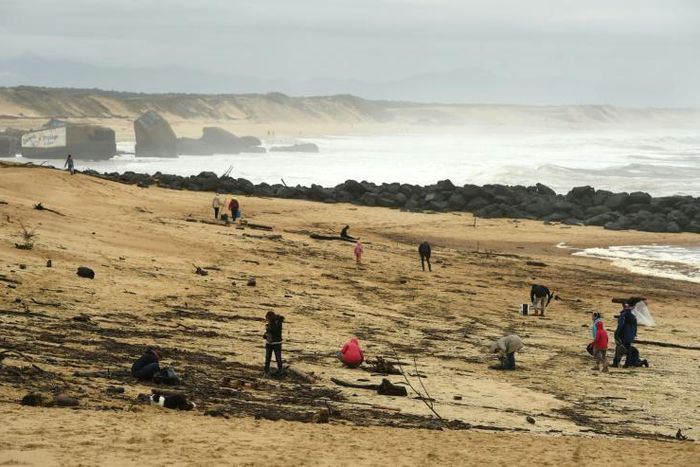 People on the beach Monday at Capbreton, southwestern France, where packages of cocaine have been found in recent days.