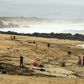 People on the beach Monday at Capbreton, southwestern France, where packages of cocaine have been found in recent days.