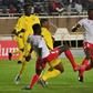 Peniel Mlapa (L) and Kodjo Fo-Doh Laba of Togo and Victor Wanyama (R) and Stanley Okumu of Kenya seek possession during a drawn Cup of Nations qualifier