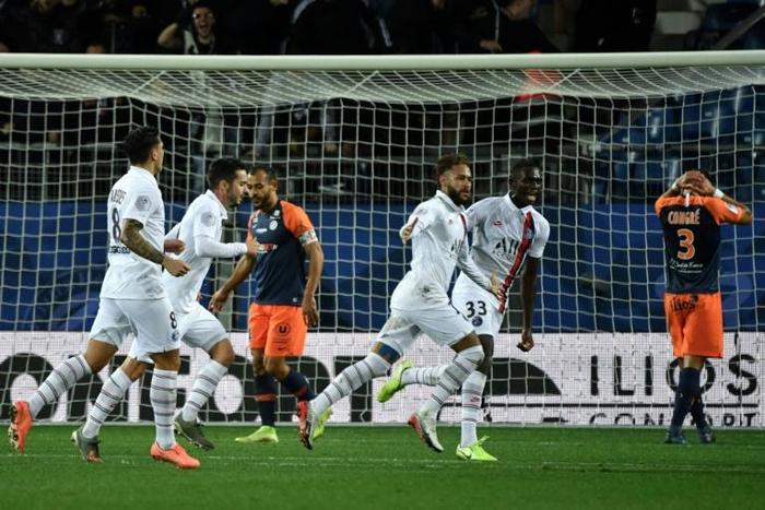 Paris Saint-Germain's Brazilian forward Neymar (C) celebrates after scoring a goal during the French L1 football match between Montpellier Herault Sport Club (MHSC) and Paris Saint-Germain (PSG) on December 7, 2019, at the Mosson stadium in Montpellier...