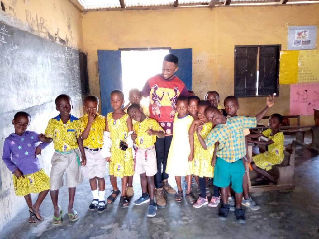 Dancing teacher Percy Sackey cuts his pupils hair