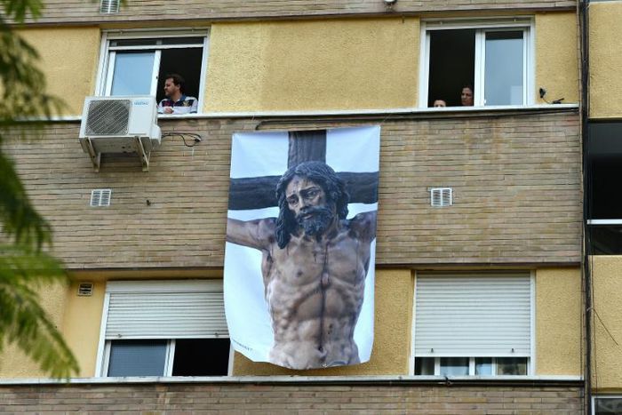 With a nationwide lockdown in place to curb the spread of COVID-19, Spaniards are finding ways to mark Holy Week from their homes