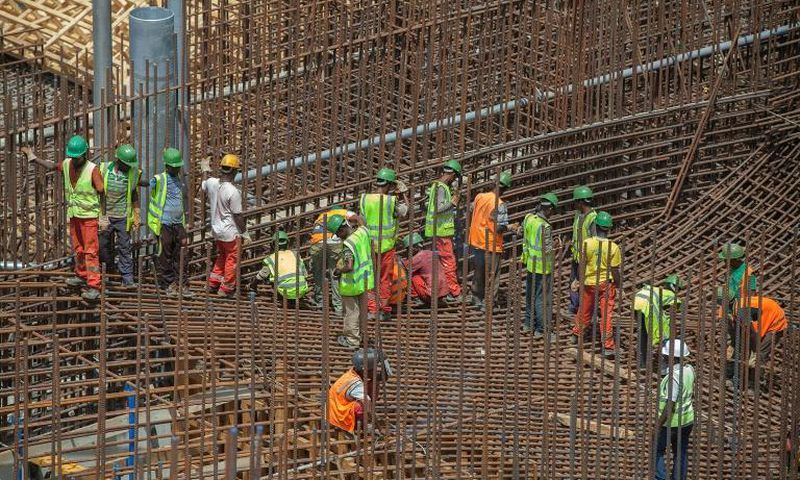 Ethiopian workers stand on scaffolding in 2015 during the construction of the Grand Renaissance Dam