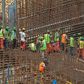 Ethiopian workers stand on scaffolding in 2015 during the construction of the Grand Renaissance Dam