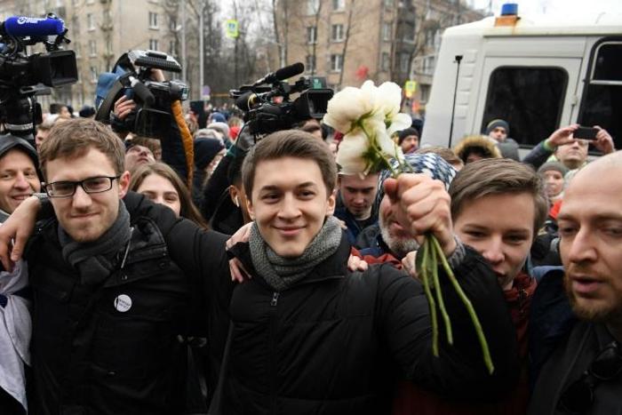 Russian student and blogger Yegor Zhukov is surrounded by supporters outside Moscow's Kuntsevsky district court after getting his suspended sentence