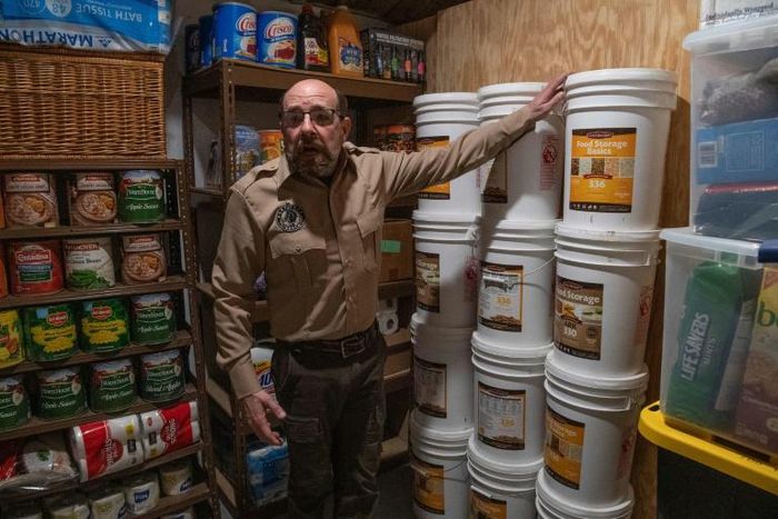Fortitude Ranch Chief Operating Officer Steve Rene shows a storage room stacked with food in Mathias, West Virginia