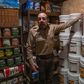 Fortitude Ranch Chief Operating Officer Steve Rene shows a storage room stacked with food in Mathias, West Virginia