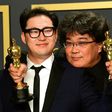 "Parasite" writers Han Jin-won and Bong Joon-ho (R) have secured a historic Oscars win a year after the 100th anniversary of South Korean cinema in 2019