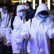 Many passengers wore hazmat suits as they arrived at Wuhan's Wuchang rail station to board some of the first trains to leave the Chinese city in more than two months