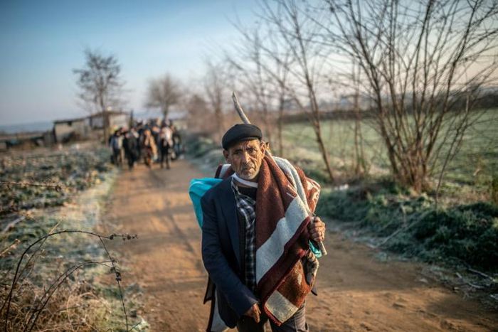 A migrant walks towards the Greek border on Sunday but he can't expect a warm welcome