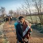 A migrant walks towards the Greek border on Sunday but he can't expect a warm welcome