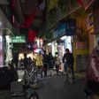 People walk in Guangzhou's "Little Africa" district in March 2018