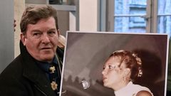 Jacky Kulik holds a portrait of his daughter Elodie who was kidnapped, raped, strangled and her corpse then burned in northern France in January 2002