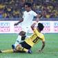 Malaysia's Muhamad Nor Azam  tries to escape a tackle from Indonesia's Hendro Siswanto in  as the home team win Kuala Lumpur