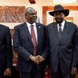 South Sudanese President Salva Kiir (C) embraced Vice-President Riek Machar (L) in a step towards peace