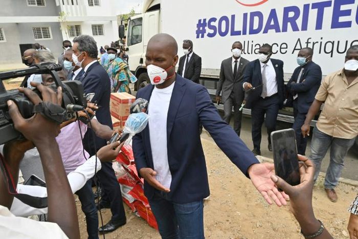 Didier Drogba speaks to media as he helps distribution of food and sanitary  products in Abidjan