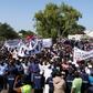 Protesters take part in a demonstration against Gambian President Adama Barrow, calling for him to keep his pledge to quit after three years in office
