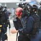 Police detain an injured man at Chater Garden in Hong Kong
