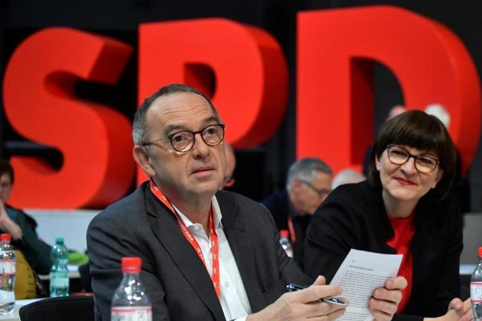 The newly elected co-leaders of Germany's SPD party have been given a mandated to seek more concessions from their CDU coalition partners