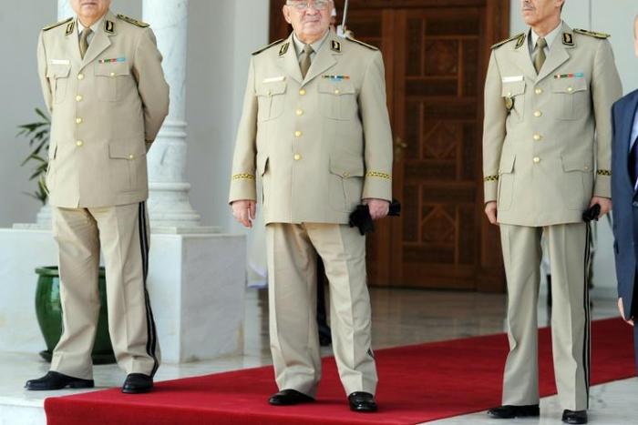Algeria's military chief Ahmed Gaid Salah (C) became de facto ruler after veteran president Abdelaziz Bouteflika resigned