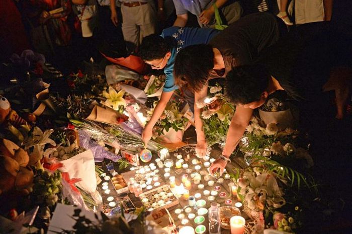 Mourners light candles during a vigil at the site of a knife attack which left two children dead in Shanghai in 2018. Attacks by society outcasts against children are not uncommon in China